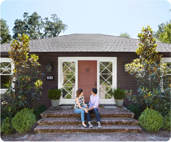 New homeowners looking back at their house