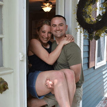 Happy Own Up customers Emily and Evan smile at the camera